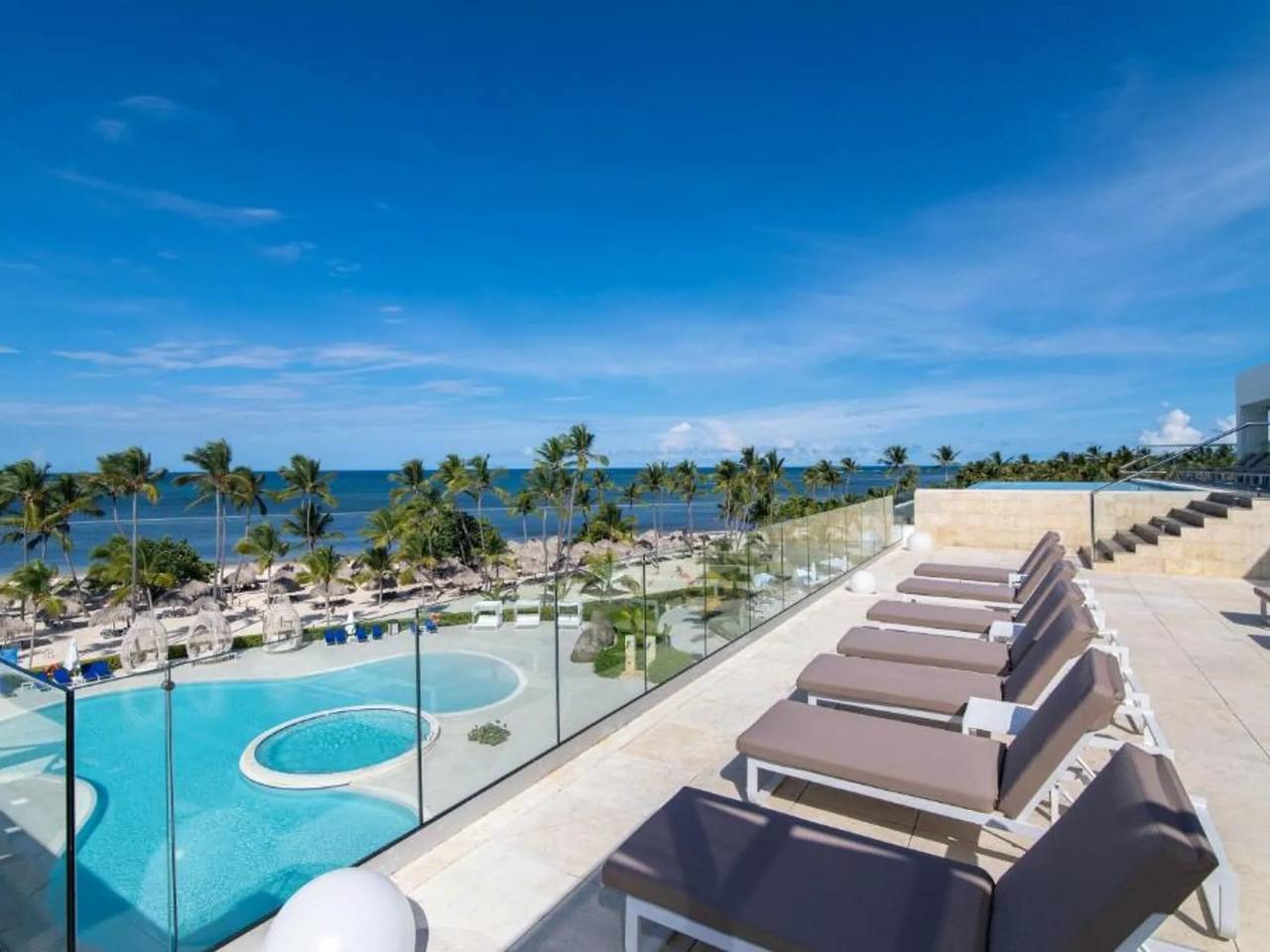 Oceanview pool deck with loungers